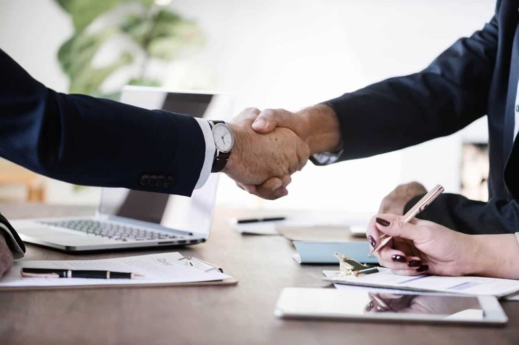 Professional handshake during a client consultation, symbolizing trust, collaboration, and tailored interior design services by DesignX Studios.